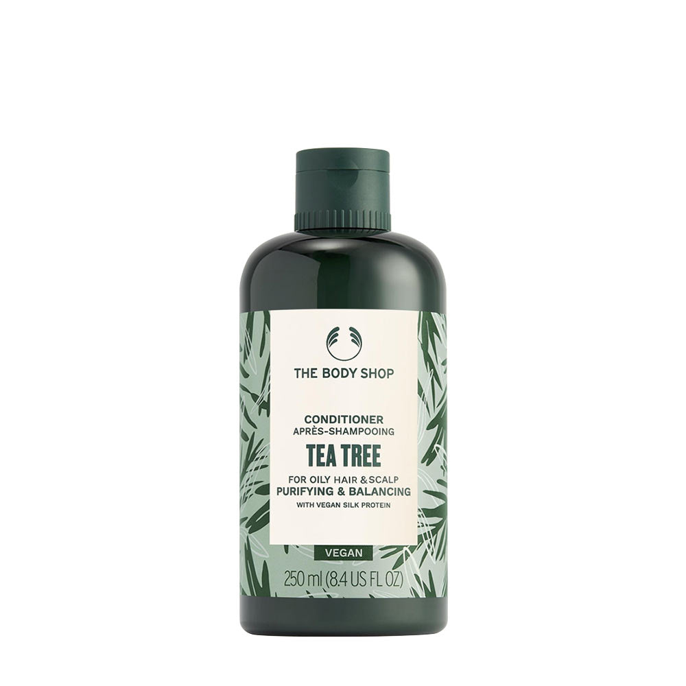 The Body Shop Tea Tree Conditioner in a 250ml bottle, ideal for oily hair and scalp, vegan, and made with natural ingredients.