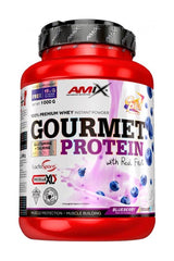 Amix Gourmet Protein powder container with blueberries, high in protein and real fruit pieces.