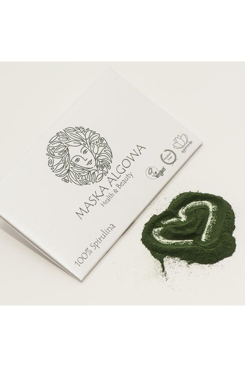 Aurospirul algae mask packaging with spirulina powder shaped like a heart for skin nourishment.