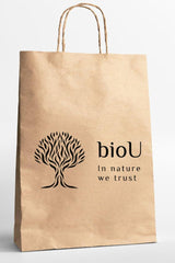 bioU paper bag with a tree design, promoting eco-friendly and sustainable shopping.