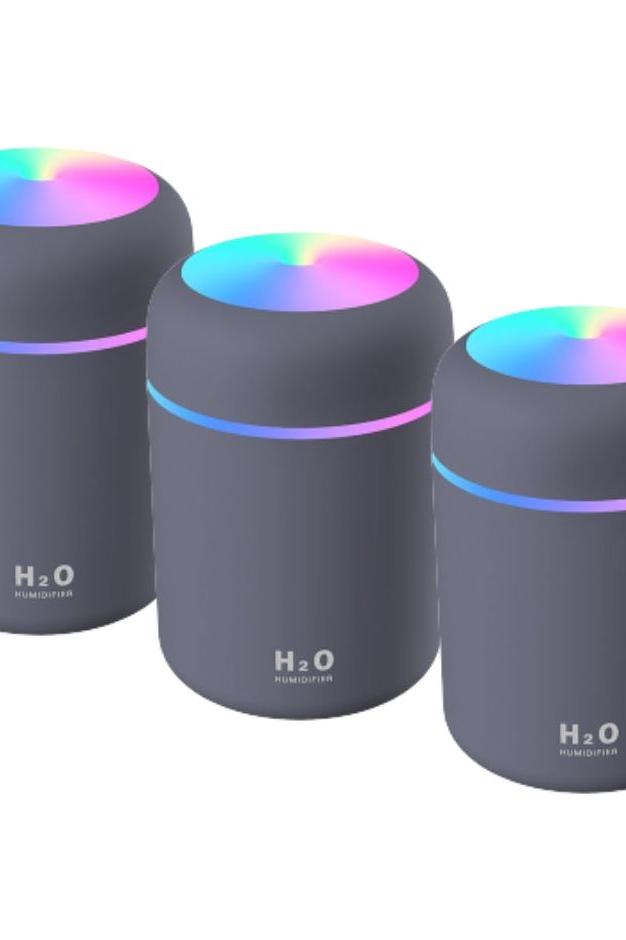 Set of 3 H2O air humidifiers in grey with colorful LED lights for aromatherapy and improved air quality.