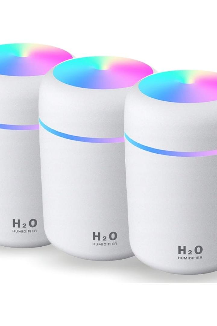 Set of 3 H2O air humidifiers with essential oil diffuser and colorful LED lights for improved air quality.