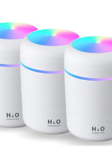 Set of 3 H2O air humidifiers with essential oil diffuser and colorful LED lights for improved air quality.
