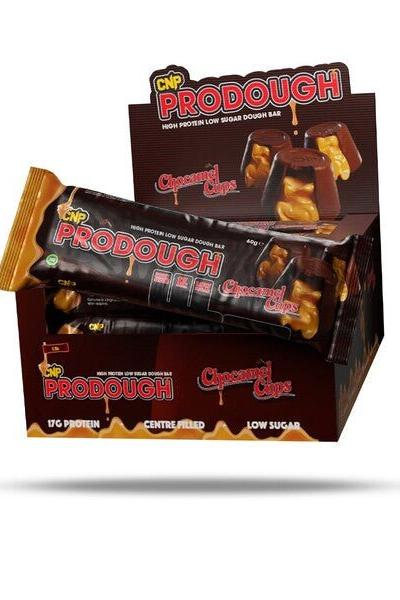 CNP ProDough protein bars display box, featuring doughnut-inspired high protein snacks with low sugar.