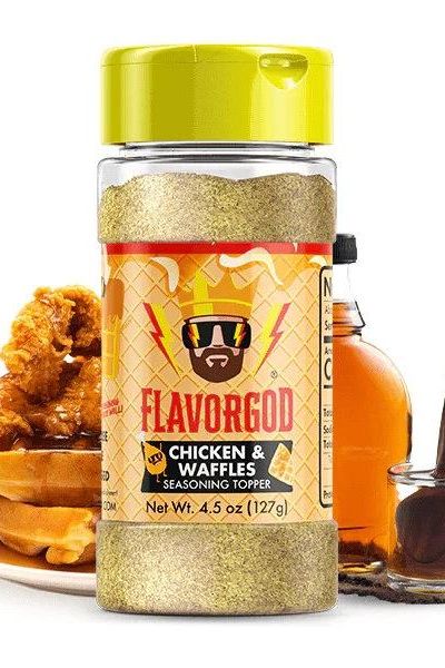 FlavorGod Chicken & Waffles Seasoning Topper bottle with delicious chicken and waffle background.