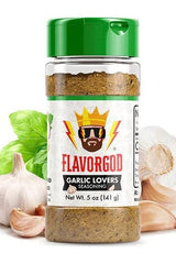 FlavorGod Garlic Lovers Seasoning bottle with garlic cloves and basil leaves in the background.