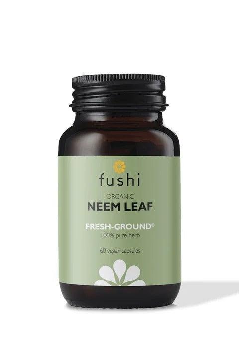 Fushi Organic Neem Leaf capsules in a dark bottle, promoting digestion and natural detox, 60 vegan capsules.
