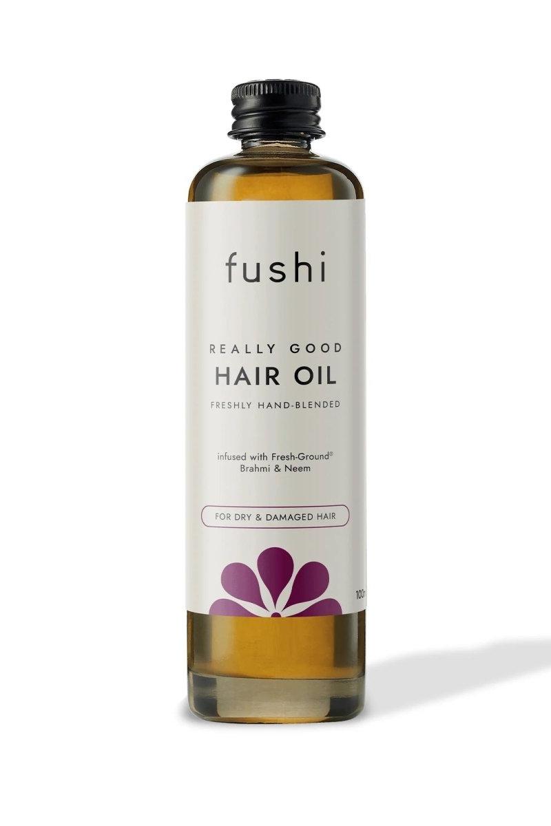 Fushi Really Good Hair Oil in a bottle, nourishing formula for dry and damaged hair with natural ingredients like Brahmi.