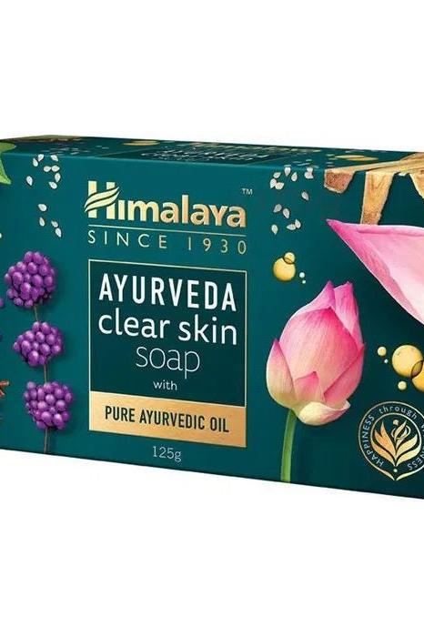 Himalaya Ayurveda Clear Skin Soap 125g packaging featuring traditional herbs and vibrant flowers for healthy, glowing skin.
