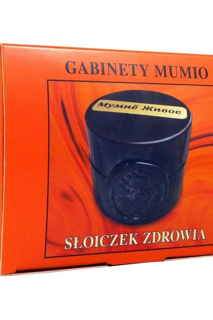 Gabinet Mumio product packaging featuring a black jar labeled Słoiczek Zdrowia against a vibrant orange background.