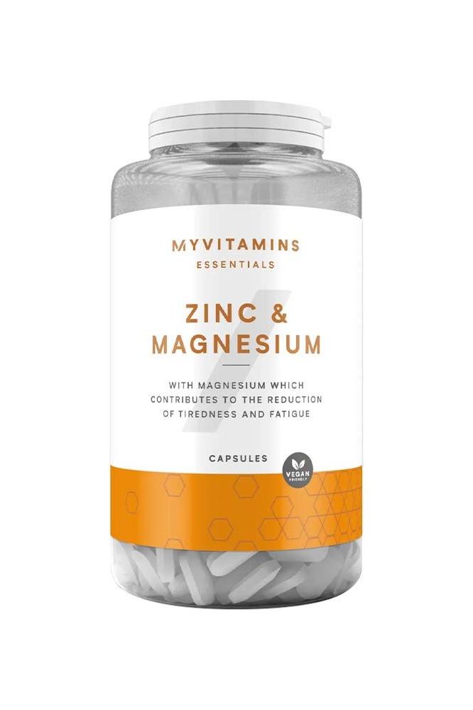 Myprotein Myvitamins Zinc & Magnesium capsules in a clear jar for immune support and fatigue reduction.