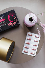 Nottevit Focus Sleep capsules on a table with a candle and vase, promoting better sleep and relaxation.