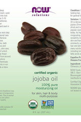 NOW Solutions organic jojoba oil label highlighting benefits for skin, hair, and body in a 237 ml bottle.