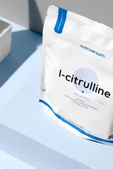 Nutriversum L-Citrulline unflavored supplement packaging on a light blue background