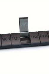 Oly - Maxi Pill Box with compartments labeled for each day of the week, designed for organizing daily medications.