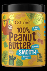OstroVit 100% Peanut Butter jar with smooth texture, labeled no added sugar, no palm oil, and all natural.