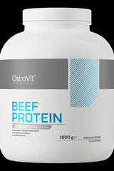 OstroVit Beef Protein supplement jar, 1800g, chocolate coconut flavor, high-quality protein source.