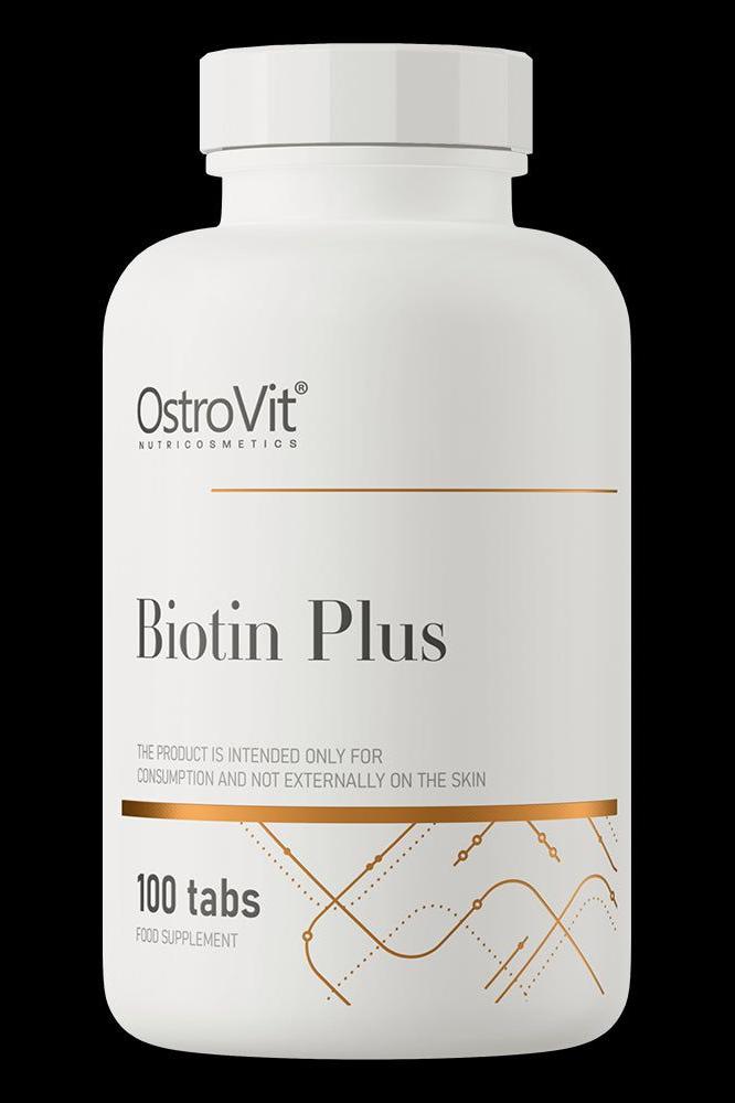 OstroVit Biotin Plus supplement bottle with 100 tabs, promoting healthy skin, hair, and nails.