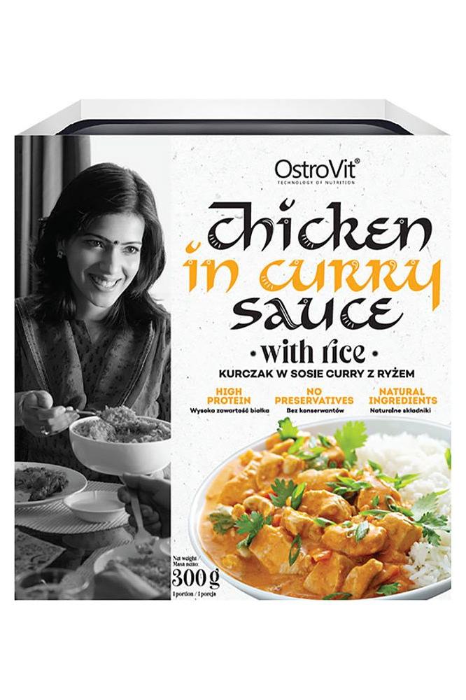 OstroVit Chicken in Curry Sauce with Rice packaging featuring vibrant curry dish and natural ingredients, 300g.