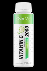 OstroVit Vitamin C 2000 Shot 100 ml in green apple flavor, promoting immune support and quick absorption.