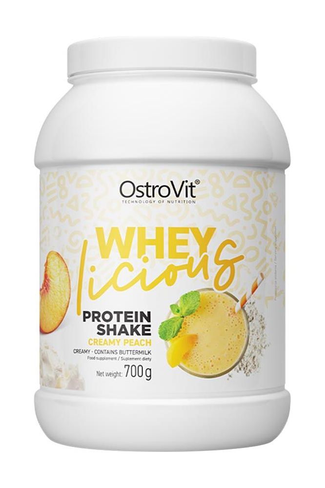 OstroVit WHEYlicious protein shake in Creamy Peach flavor, 700g container for athletes and active lifestyles.