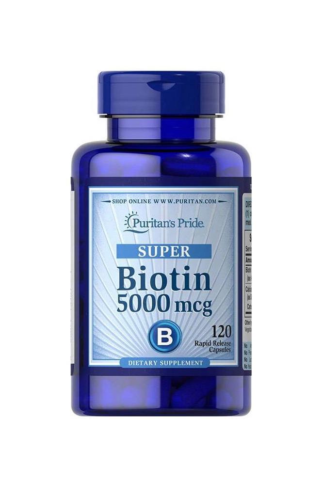 Puritan's Pride Biotin 5000 mcg supplement bottle, 120 rapid release capsules for healthy skin, hair, and nails.