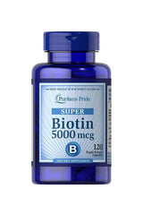 Puritan's Pride Biotin 5000 mcg supplement bottle, 120 rapid release capsules for healthy skin, hair, and nails.