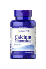 Puritan's Pride Calcium Magnesium supplement bottle with 100 caplets for bone health and muscle support.