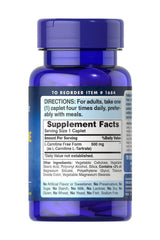 Puritan's Pride L-Carnitine 500 mg supplement bottle with serving instructions and facts label.