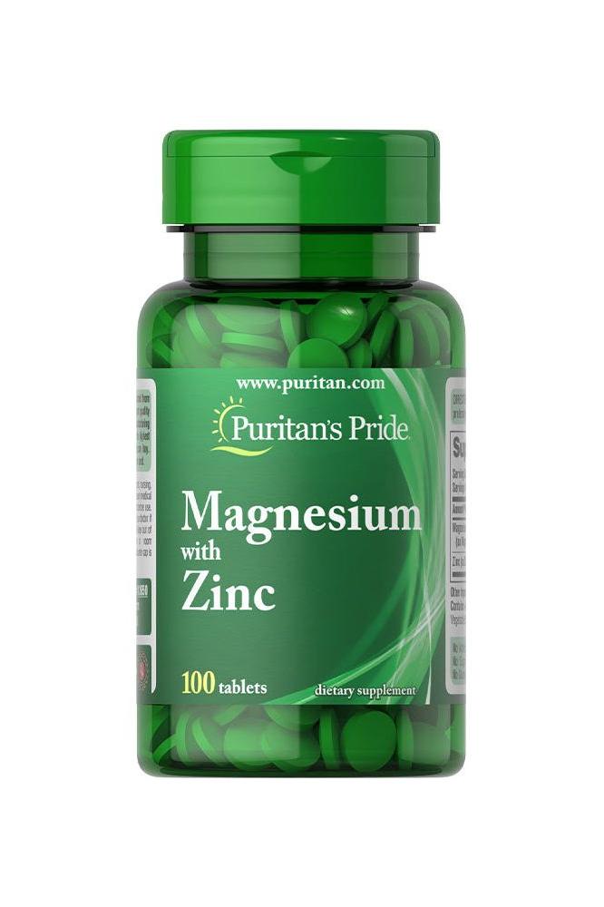 Puritan's Pride Magnesium with Zinc dietary supplement, 100 tablets, green bottle for immune health and muscle function.