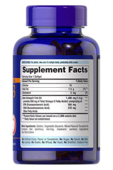 Puritan's Pride Omega-3 Fish Oil softgel bottle with supplement facts label, 1360 mg, 950 mg active omega-3.