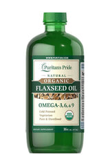 Puritan's Pride organic flaxseed oil, rich in Omega-3, -6, and -9, cold pressed, 473 ml bottle.