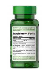 Puritan's Pride Turmeric 400 mg supplement bottle with label showing serving size and ingredients.