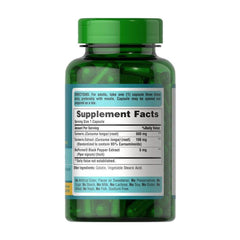 Puritan's Pride turmeric curcumin supplement bottle with dosing information and green capsules.