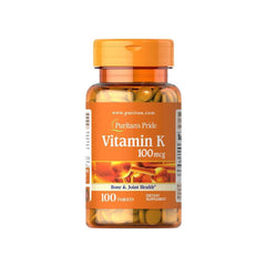 Puritan's Pride Vitamin K 100 mcg dietary supplement bottle with 100 tablets for bone and joint health.
