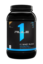 Rule One R1 Whey Blend protein powder packaging featuring 100% whey, 24g protein, and 5g BCAA per serving.