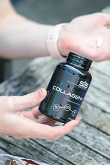Hands holding a bottle of Science in Sport Collagen+ capsules for joint health and mobility.
