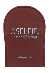 Selfie applicator mitt in brown for even self-tanning application, featuring soft texture and water-resistant barrier.
