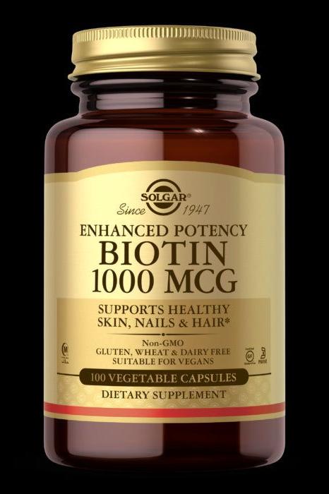 Solgar Biotin 1000 MCG dietary supplement for healthy skin, hair, and nails in a 100 vegetable capsule bottle.