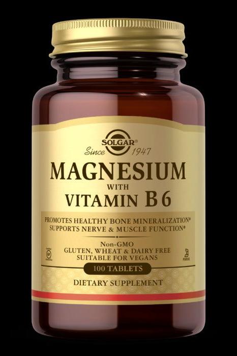 Solgar Magnesium with Vitamin B6 dietary supplement in a glass bottle, 100 tablets, supports nerve and muscle function.