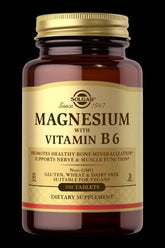 Solgar Magnesium with Vitamin B6 dietary supplement in a glass bottle, 100 tablets, supports nerve and muscle function.
