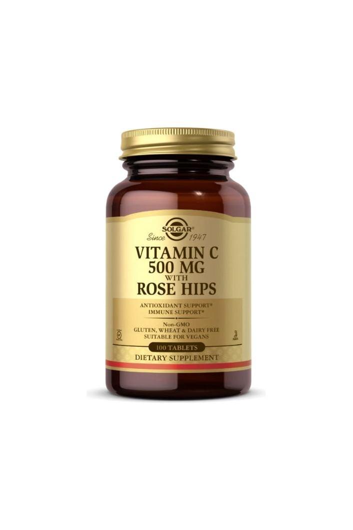 Solgar Vitamin C 500 mg dietary supplement with rose hips in a brown bottle for immune support and collagen production.