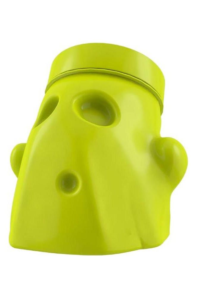 Bright green spooky face-shaped container for supplements, designed for fun and functionality.