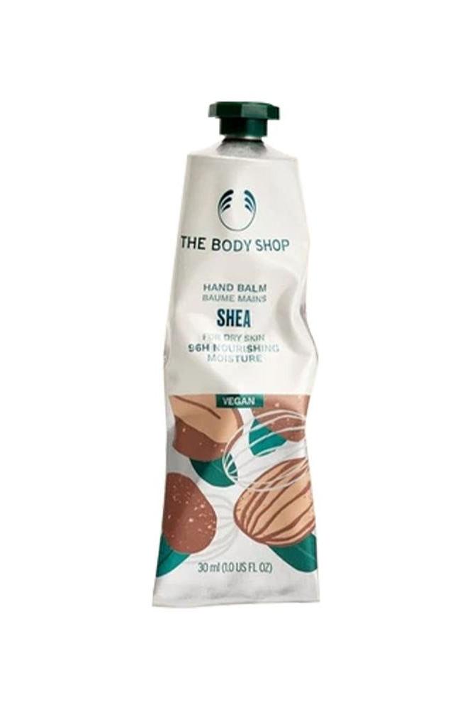 The Body Shop Shea Hand Balm in a 30 ml tube, vegan formula for intense moisture and nourishment for dry hands.