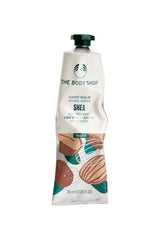 The Body Shop Shea Hand Balm in a 30 ml tube, vegan formula for intense moisture and nourishment for dry hands.