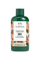 The Body Shop shower cream for dry skin, vegan formula in a green bottle, nutty and creamy scent.