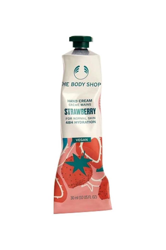 The Body Shop Strawberry Vegan Hand Cream tube, 30 ml, designed for normal skin, providing 48 hours of hydration.