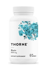 Thorne Biotin dietary supplement bottle for healthy hair, skin, and nails with 8000 mcg per serving.