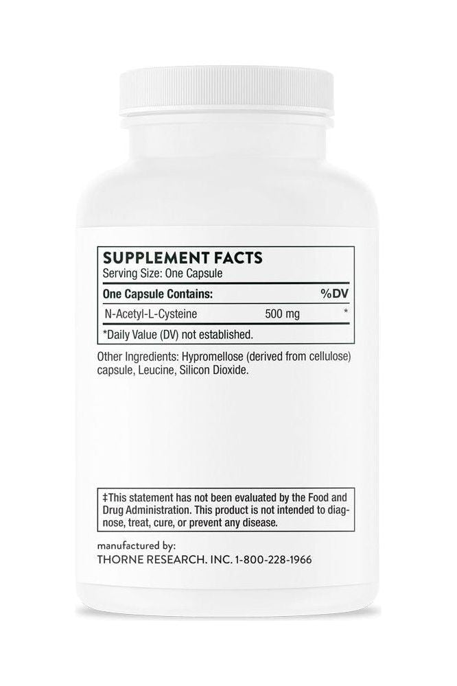Thorne NAC N-Acetylcysteine supplement facts label with dosage information on white bottle. Thorne NAC N-Acetylcysteine supplement facts label with dosage information on white bottle.