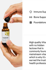 Thorne Vitamin D Liquid in a dropper bottle, promoting bone health and immune support.